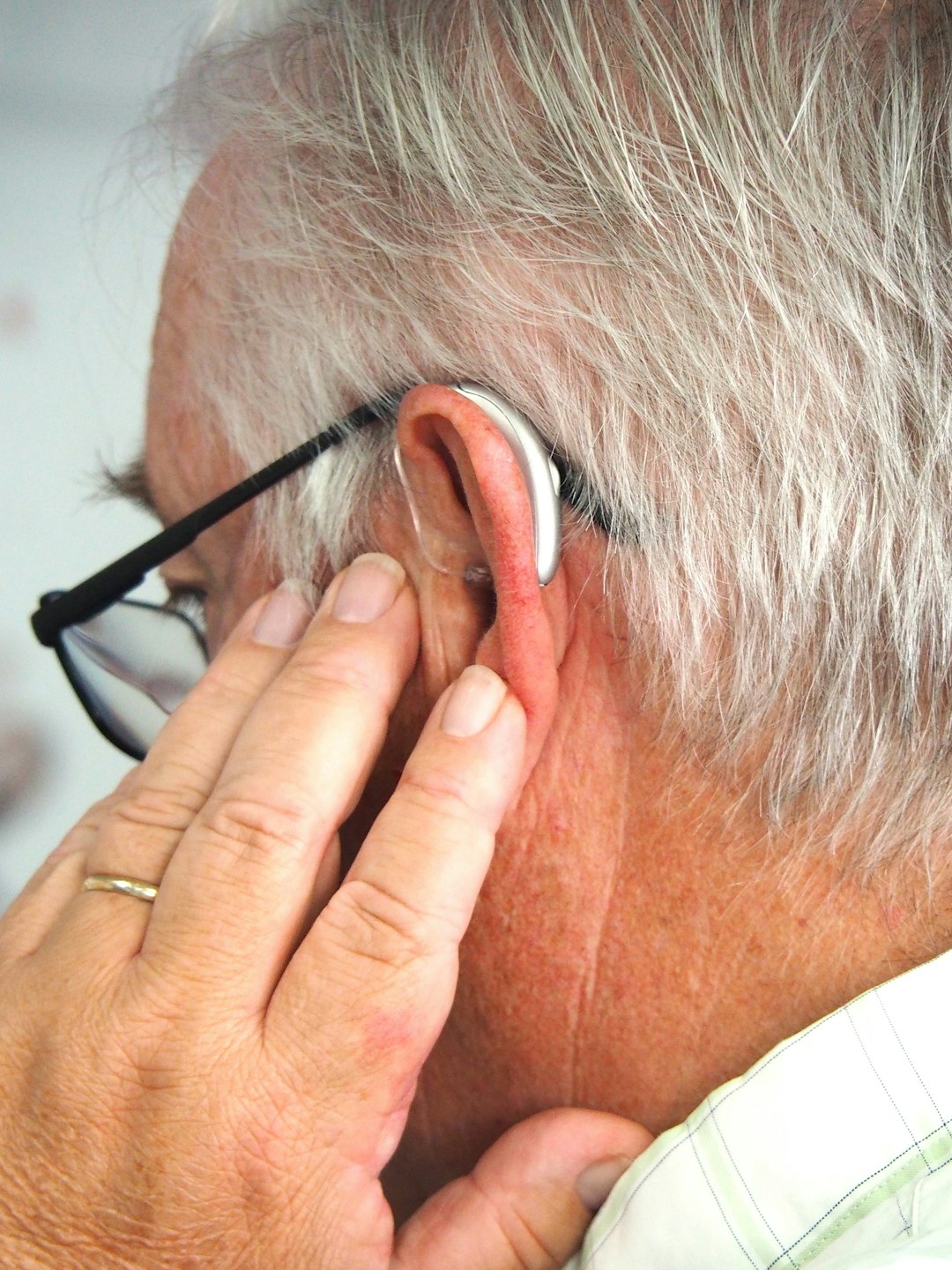 a man with a hearing aid.